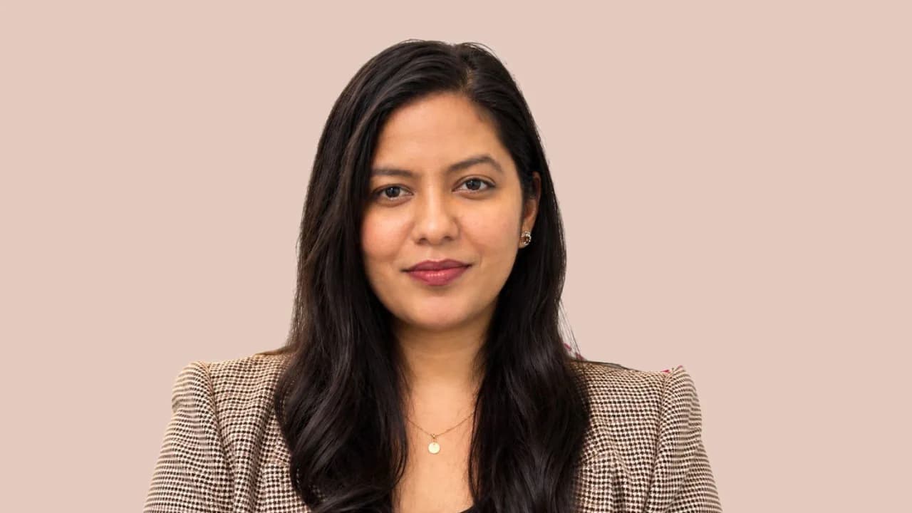 A folded newspaper and a dinner plate with cutlery, for Aarti Yadav's move from consumer brand PR to Sodexo India