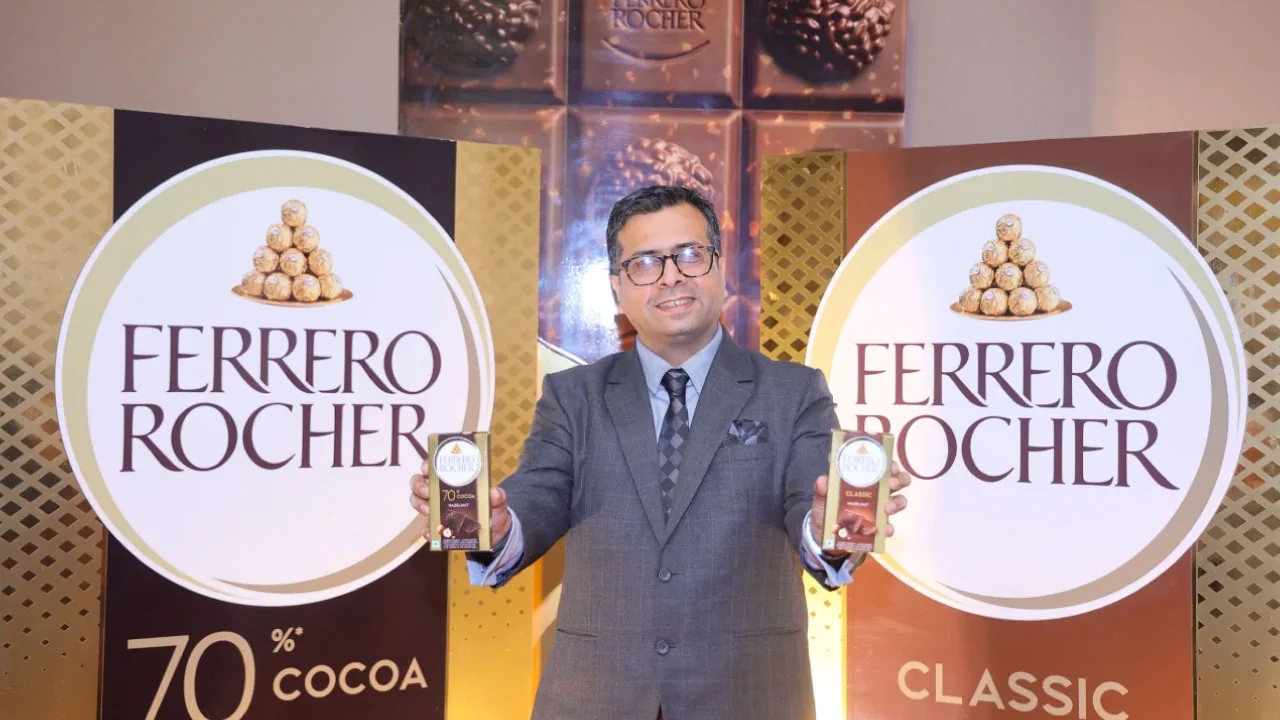 A segmented chocolate bar and a whole hazelnut as halftone cutouts, for Ferrero Rocher entering India's premium bar segment at Rs 499