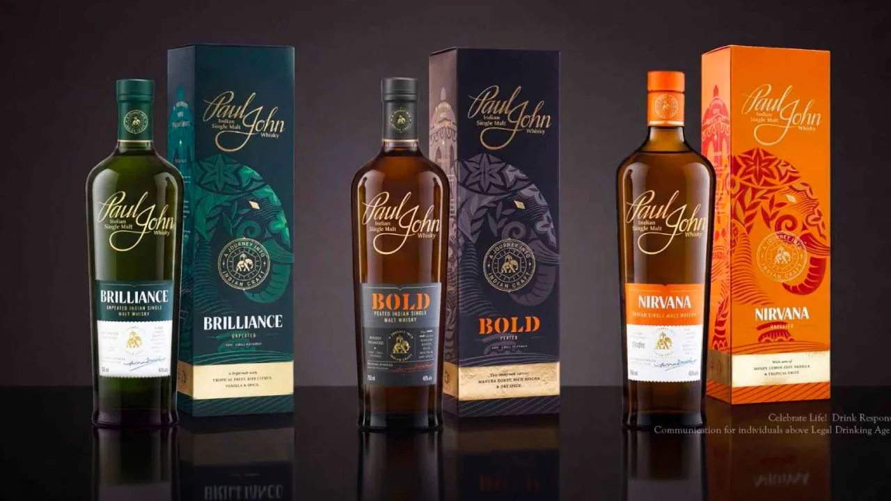 A whisky bottle and a carved elephant figure, as halftone cutouts, for the Paul John brand identity refresh