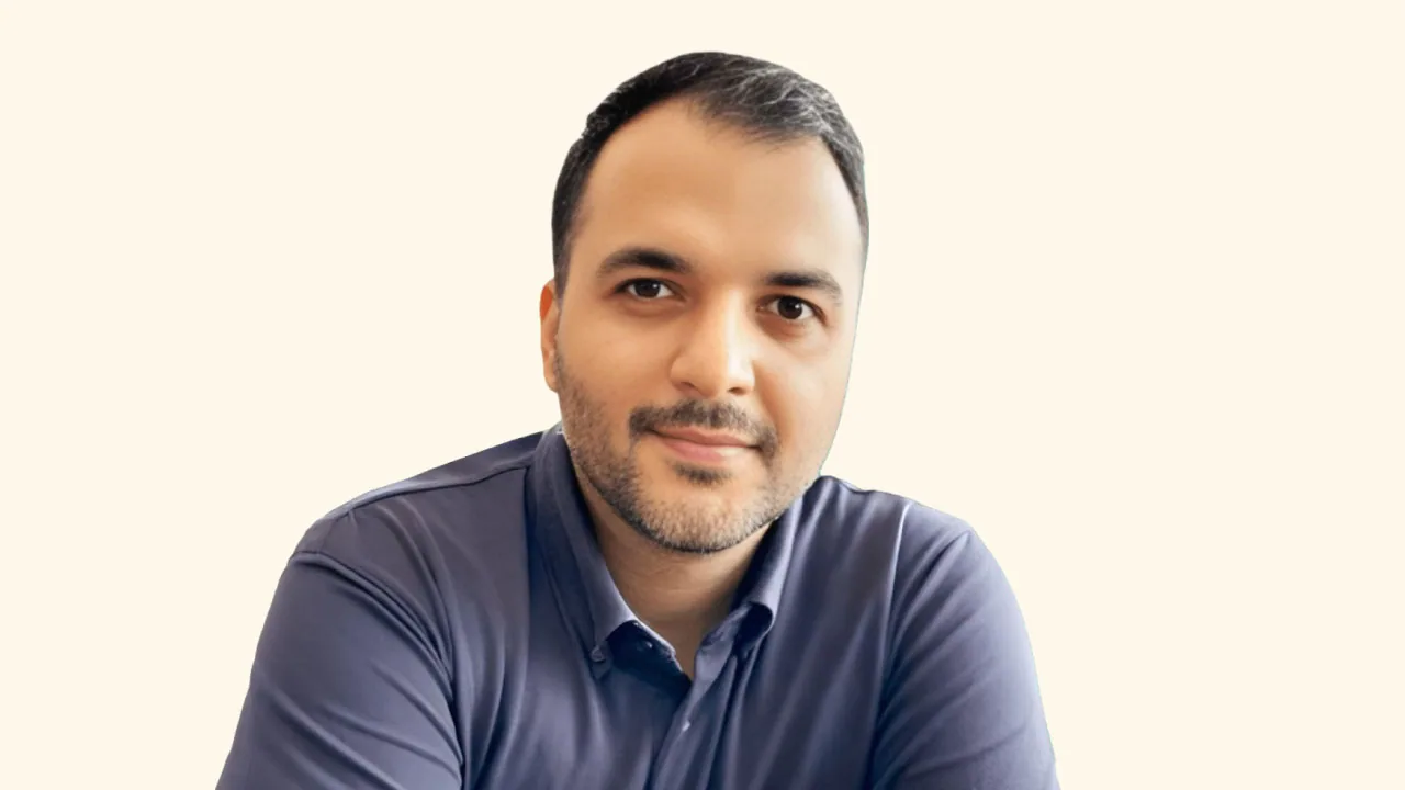 Pranav Kapur, elevated to senior vice president at McCann India, in a dark shirt on a terracotta backdrop