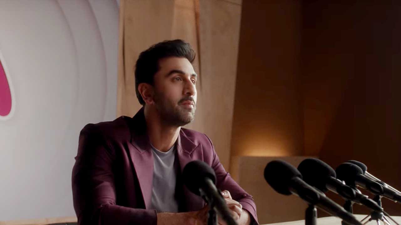 Ranbir Kapoor seated before a bank of microphones in the Myntra campaign film