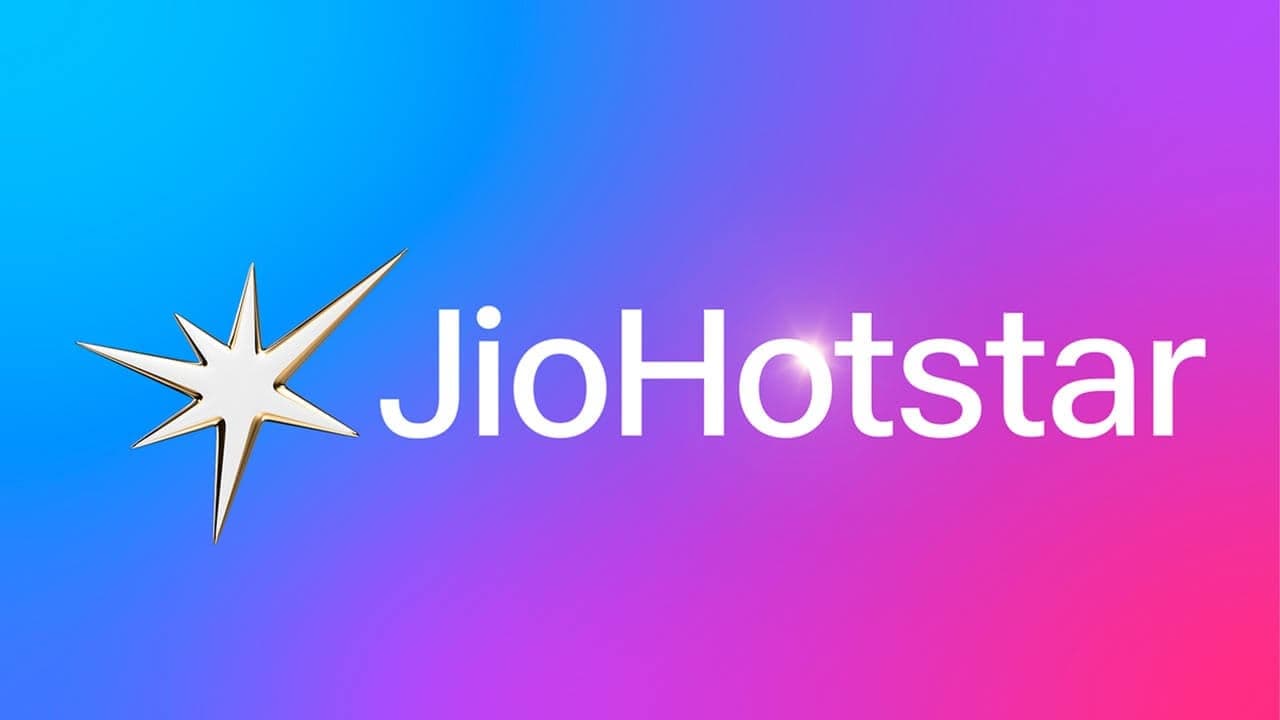 The JioHotstar wordmark and star device on a blue to magenta gradient