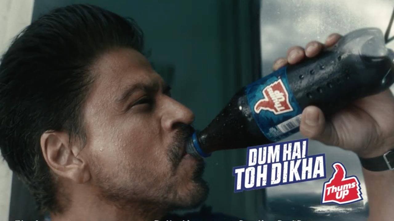 Shah Rukh Khan drinking from a bottle in the Thums Up campaign film