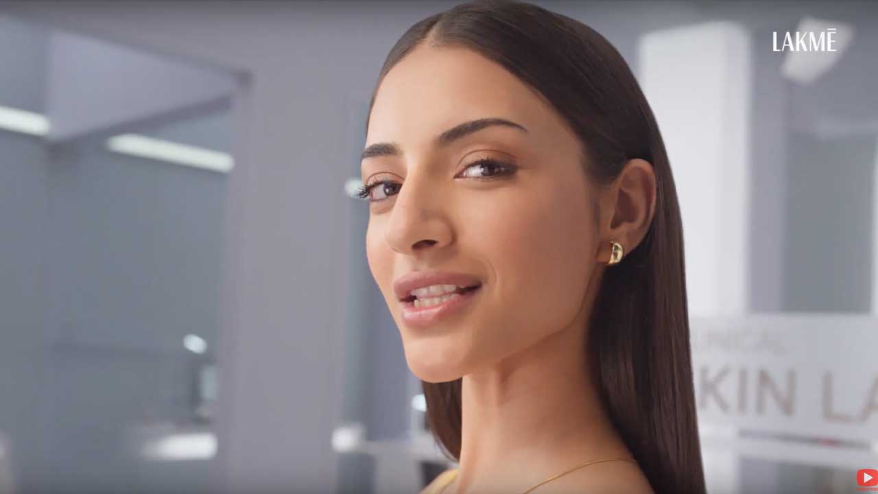 A woman looking into the camera in a Lakmē campaign film still