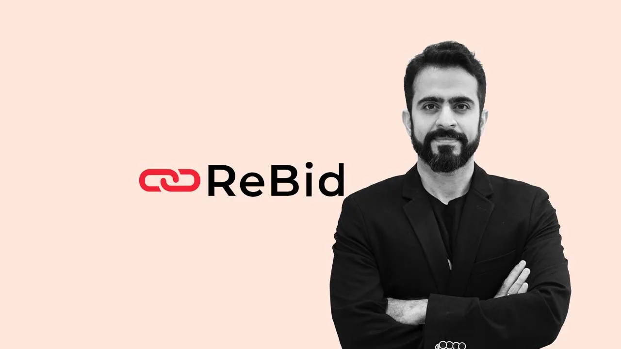 Rajiv Dingra, founder and chief executive of ReBid, beside the company logo as it adds ChatGPT Ads to its platform
