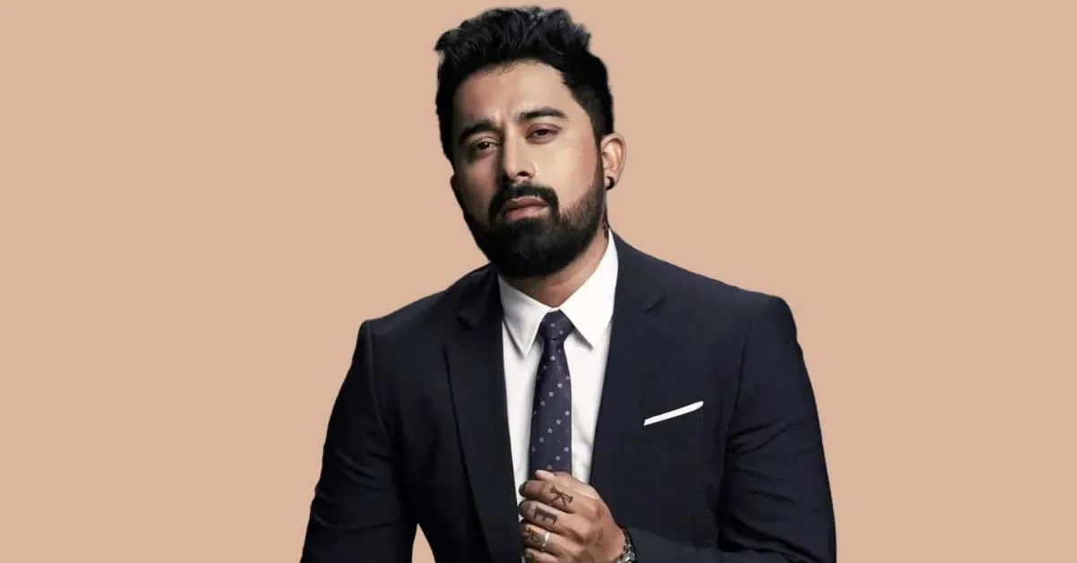 Rannvijay Singha, who has joined hydration brand No Secrets as a shareholder, in a dark suit and tie against a beige backdrop