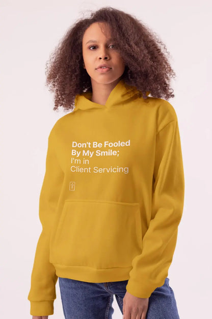 Don't Be Fooled By My Smile; I'm in Client Servicing – Premium Unisex Hooded Sweatshirt for Bold Professionals - Ad Tribe