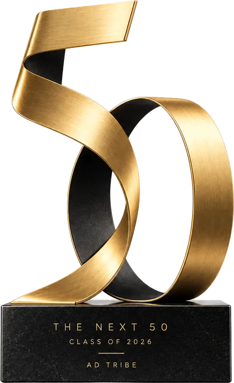 The Next 50 trophy: a gold 50 on a black marble base engraved Class of 2026, Ad Tribe